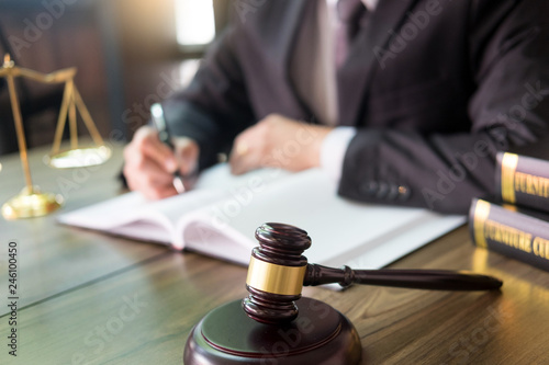 gavel and soundblock of justice law and lawyer working on wooden desk background.