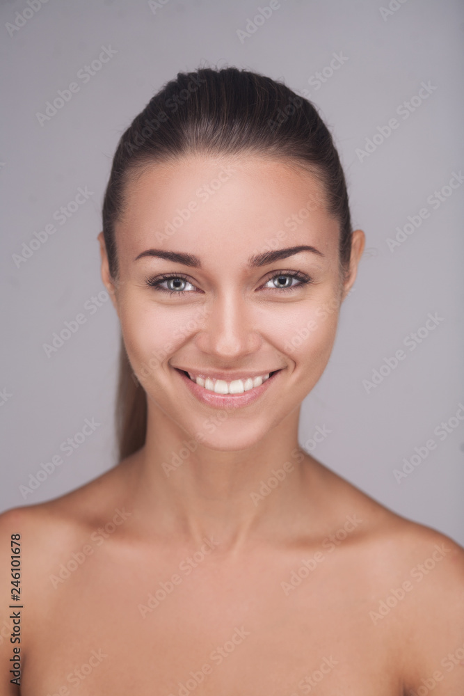 brunette woman with glad smile showing her perfect teeth posing brunette woman with glad smile showing her perfect teeth posing