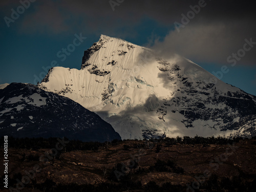 clouds casting shadow on mountain in patagonia