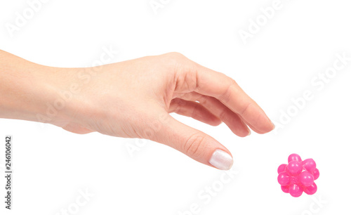 Hand with pink spiky ball for massage, healthcare concept