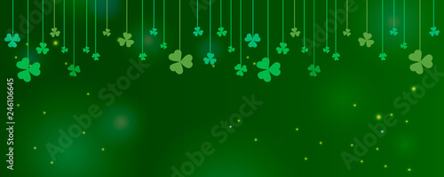 Clover shamrock leaves hung on strings on dark green background. Abstract St. Patrick's day border horizontal panorama background with place for your text for greeting cards design or poster. Vector 