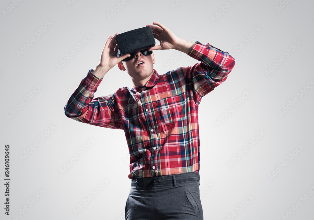 Guy in mask experiencing virtual reality as new entertainment device Guy in mask experiencing virtual reality as new entertainment device