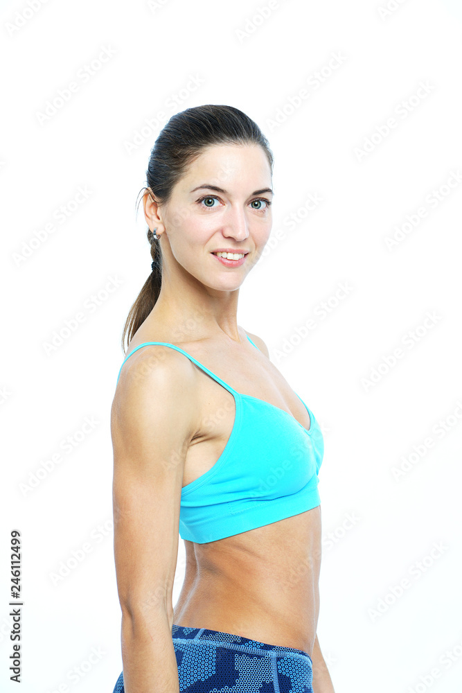 Attractive athletic girl portrait on white background looking with smile. Attractive athletic girl portrait on white background looking with smile.
