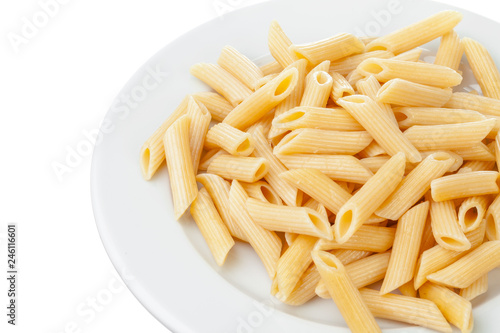 Penne rigate in porcelain bowl isolated on white background