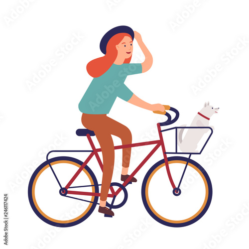Young woman dressed in casual clothes riding bike