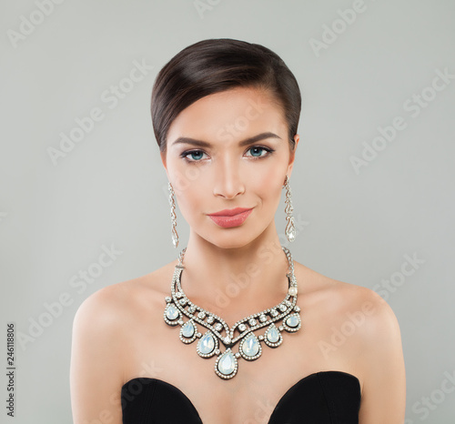 Glamorous fashion model woman with short hair, makeup and diamond jewelry, portrait