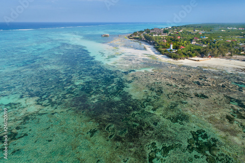 Low tide in lagoon and view to lighthouse on Zanzibar