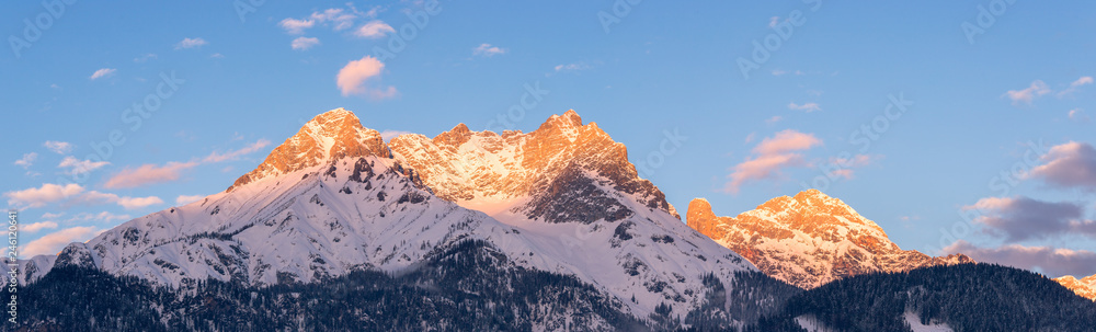 Idyllic snowy mountain peaks, setting sun in winter, landscape, Alps, Austria Idyllic snowy mountain peaks, setting sun in winter, landscape, Alps, Austria