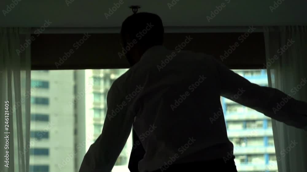 Happy Businessman jumping on hotel bed, super slow motion, 120fps Happy Businessman jumping on hotel bed, super slow motion, 120fps