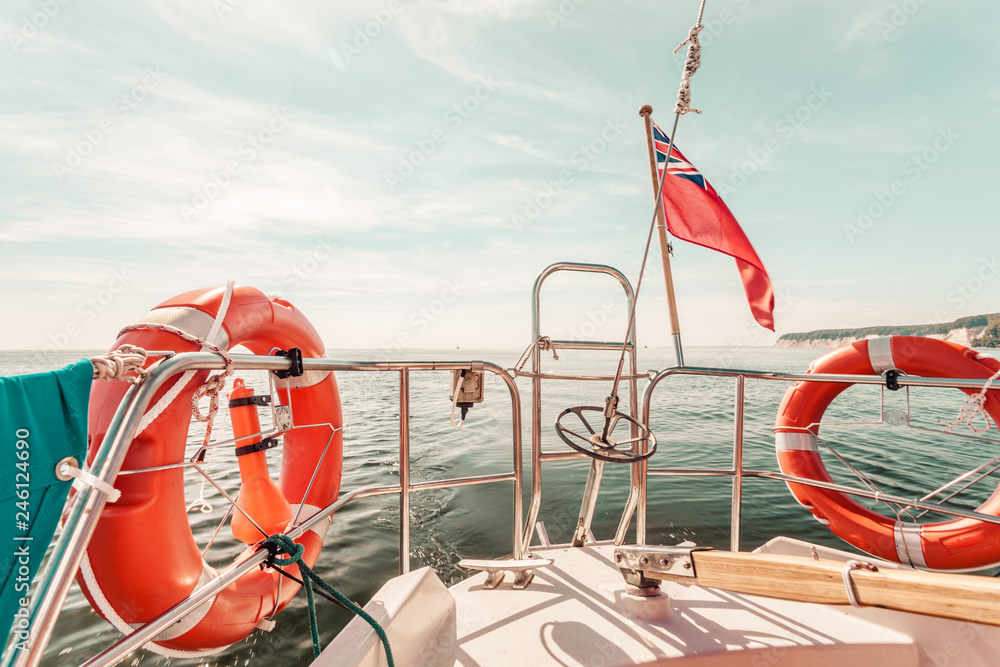 Fototapeta premium United Kingdom flag and lifebuoy on sailing boat