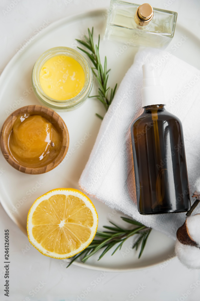 Organic skincare ingredients with towel, face mist and manuka honey,  natural treatments ingredients with lemon, honey, balm salve, rosemary  herb, spa still life setting Stock Photo | Adobe Stock