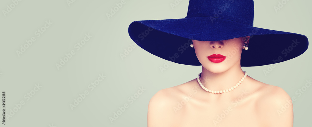 Fashion portrait of stylish woman with red lips makeup, elegant hat and pearls