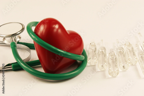 Pharmaceutical medicament, cure in container for health, stethoscope and heart on white background.