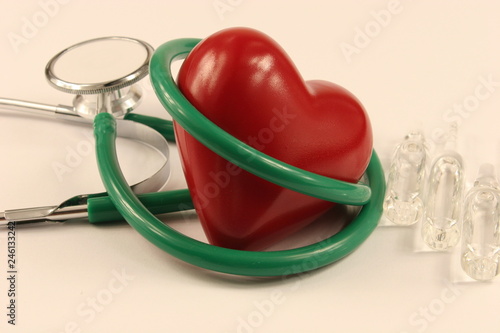 Pharmaceutical medicament, cure in container for health, stethoscope and heart on white background.