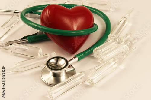 Pharmaceutical medicament, cure in container for health, stethoscope and heart on white background.