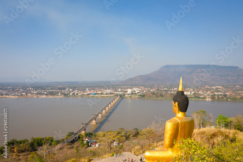 Buddha statue located on the mountain in Pakse photo