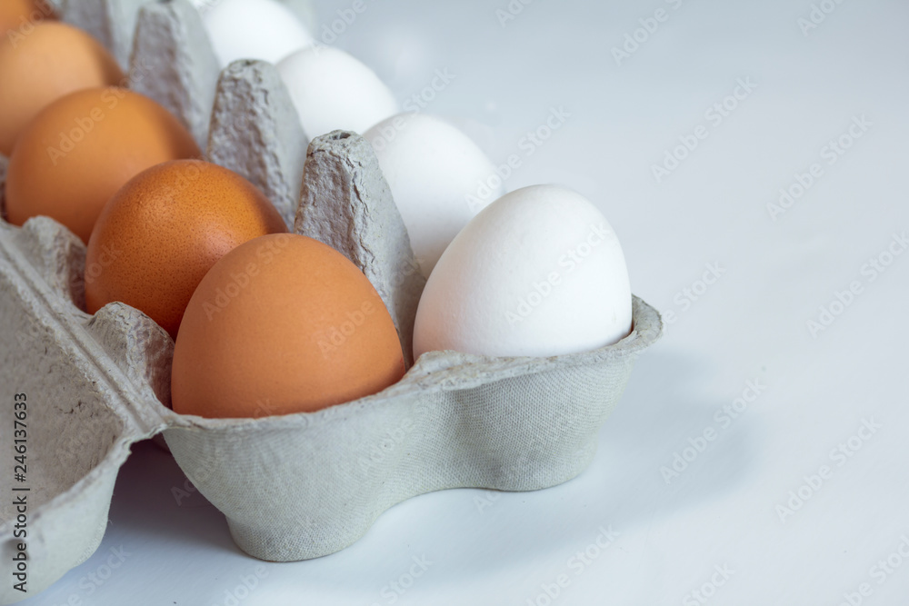 chicken eggs in a cardboard tray on background chicken eggs in a cardboard tray on background
