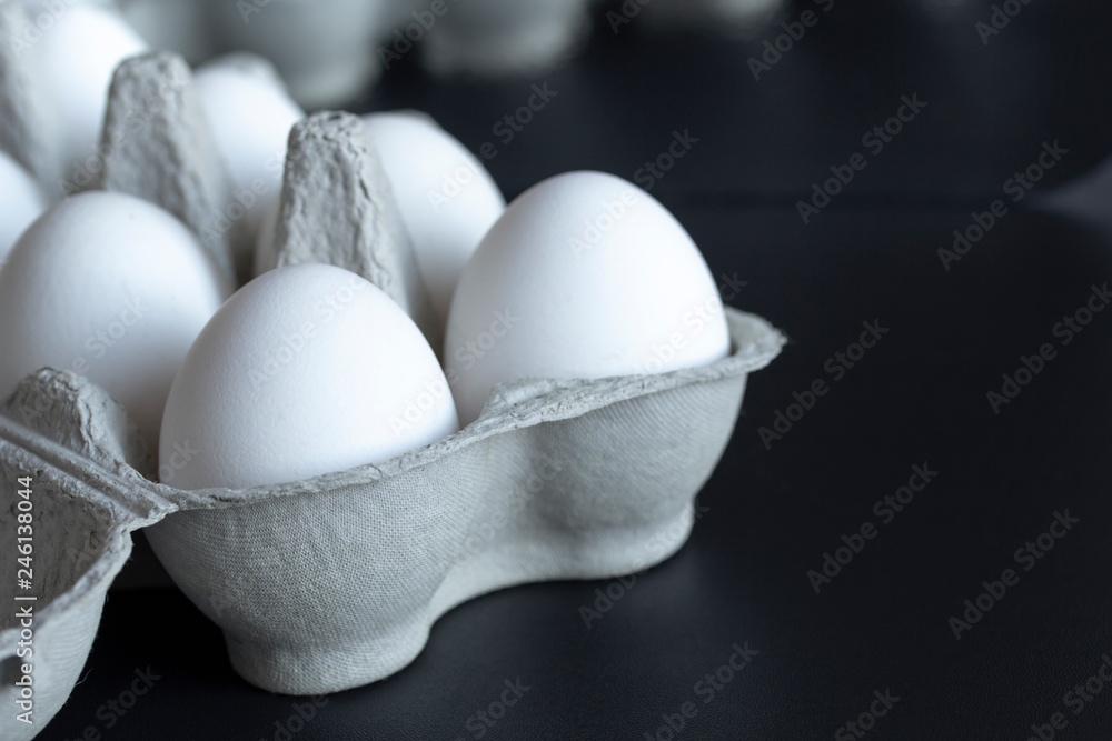 chicken eggs in a cardboard tray on background chicken eggs in a cardboard tray on background