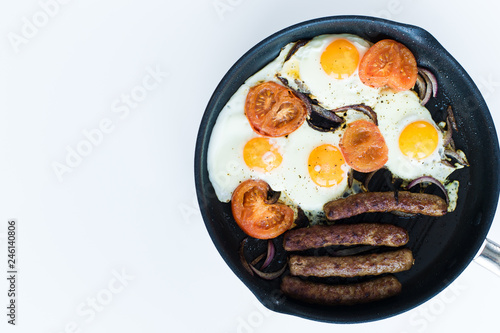 Classic English Breakfast in a frying pan. White background. The view from the top. Space for text.
