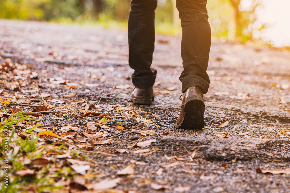 Hiking man traveling with backpack in mountains