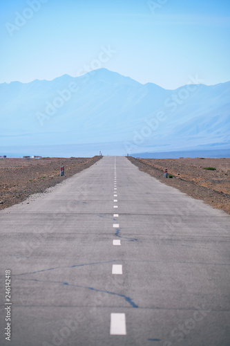 Empty asphalt straight highway road in Mongolia between mongolian towns Khovd and Altai