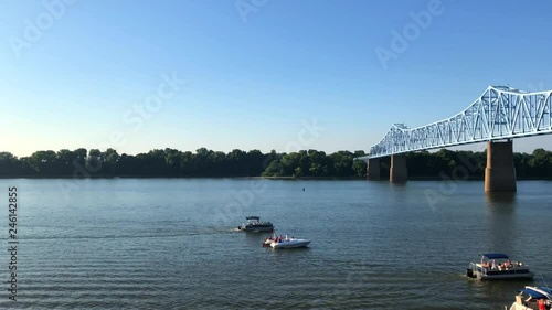 View of Ohio River and Glover Cary Bridge in Owensboro, Kentucky. Shot from Smothers Park. Left to right camera movement.