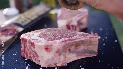 Rib-Eye steak is peppered - Rib-Eye Steak wird gepeffert 4k PRORES Footage photo