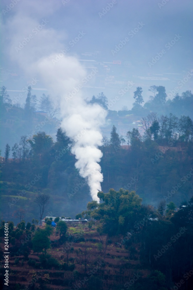 Winter fire smoke in a small remote hilly village of Nepal