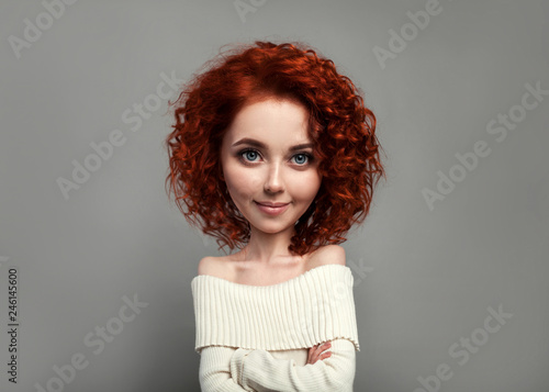 Funny red curly girl with big head and funny hairstyle. Caricature stylization of female logic photo