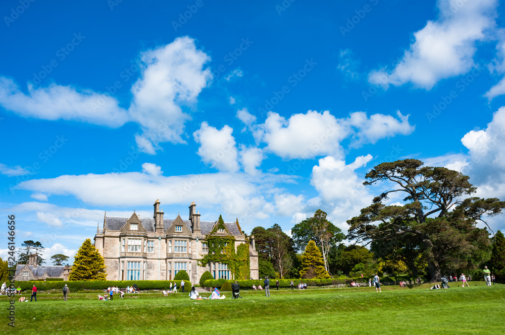 Tourists relaxing around the gardens of Muckross house in the ring of Kerry