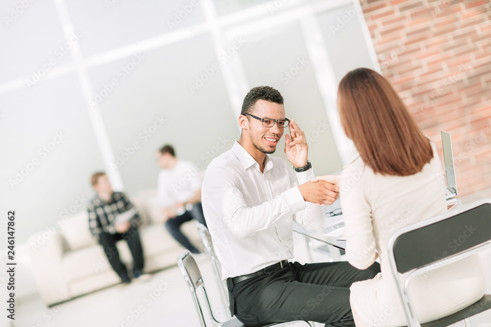 handshake between the Manager and the client in the Bank office handshake between the Manager and the client in the Bank office