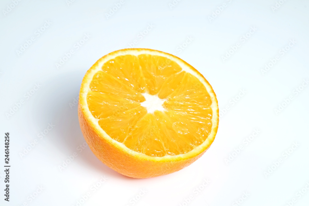 Close up image of juicy organic halved orange with visible core texture on isolated white background with a lot of copy space for text. Macro shot of bright citrus fruit. Top view. Close up image of juicy organic halved orange with visible core texture on isolated white background with a lot of copy space for text. Macro shot of bright citrus fruit. Top view.