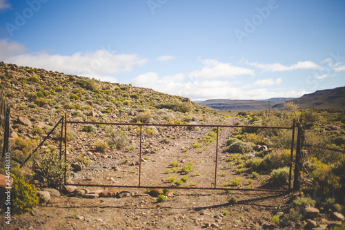 Iconic scenes from the karoo region in South Africa, gravel roads and semi desert conditions photo