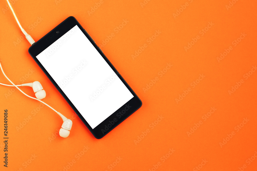 custom made wallpaper toronto digitalSmartphone and headphones on an orange background. Top view, space for text