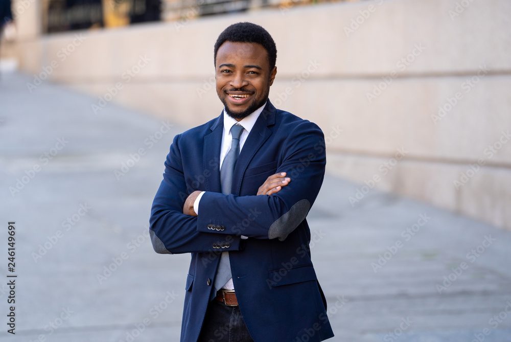 Half length portrait of an attractive stylish and successful businessman outside city street Half length portrait of an attractive stylish and successful businessman outside city street