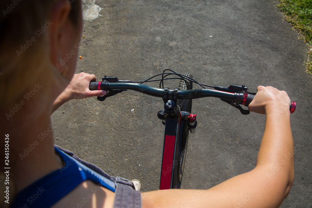 Young beautiful woman travels by bicycle on country side. Young beautiful woman travels by bicycle on country side.