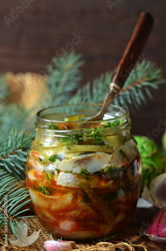 Herring with onions and tomato sauce in a jar