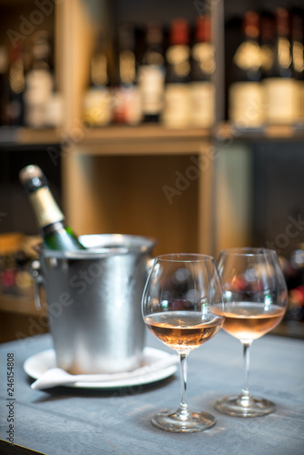 Wallpaper Mural A bottle of champagne in a bucket with ice on the table. Two cold glasses of sparkling wine. Torontodigital.ca