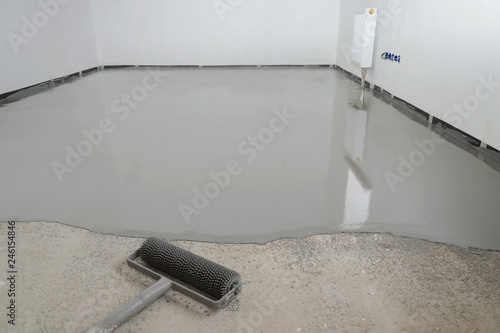 Self-leveling epoxy. Leveling with a mixture of cement floors.