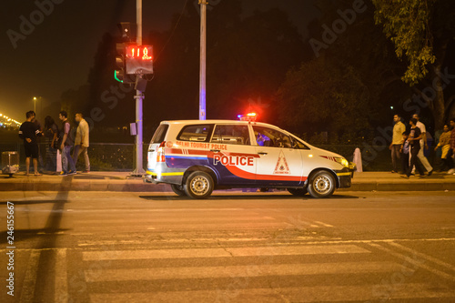Delhi police vehicle patrolling near India Gate in New Delhi, India