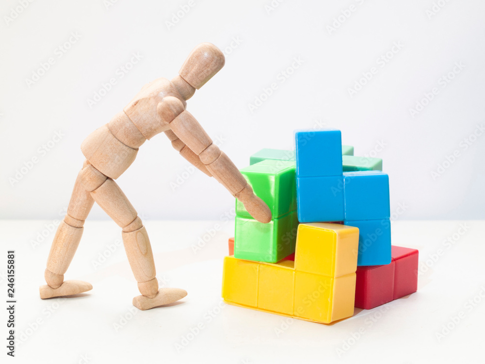 man stacking blocks man stacking blocks