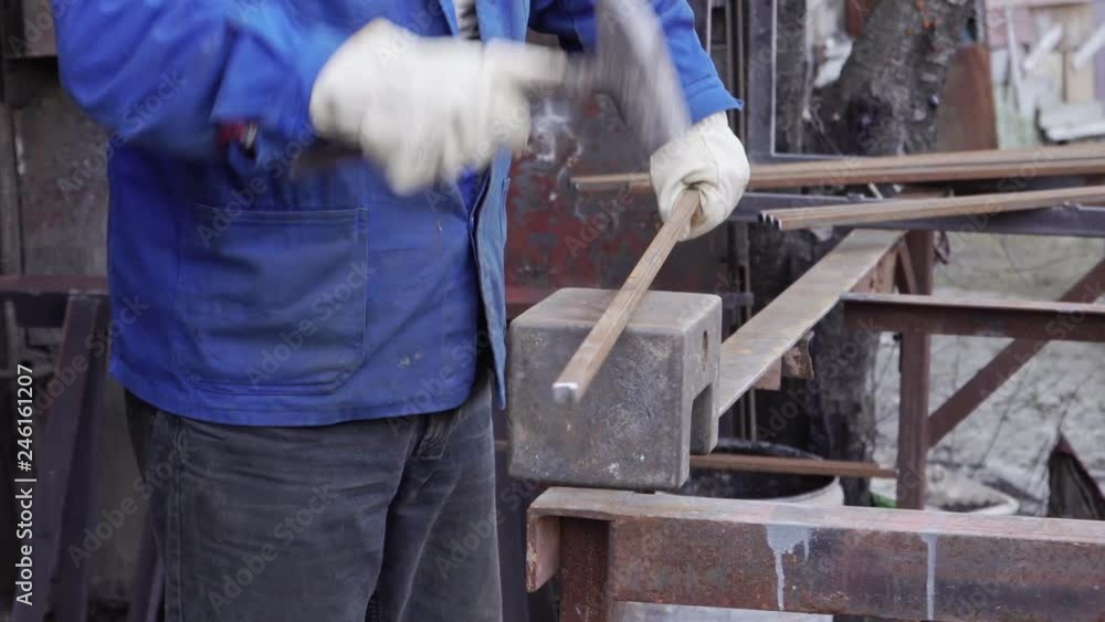 Blacksmith hammering on a metal rod in 4k with sound Blacksmith hammering on a metal rod in 4k with sound