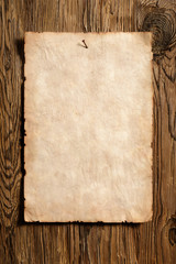 old paper advert on aged wood