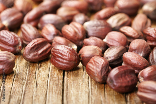 close up of dried jojoba seeds on the wooden table