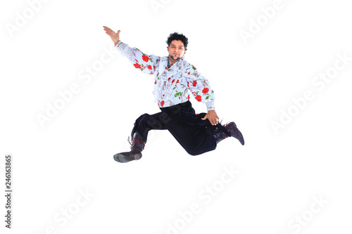 Gypsy male dancer in traditional dress performs folk dance