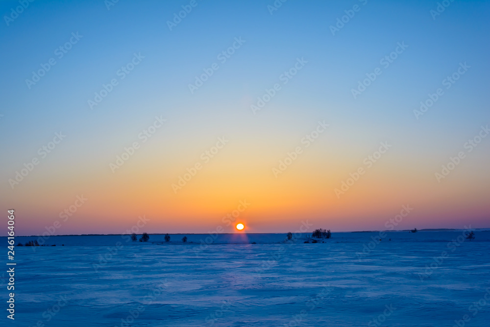 Sunrise in winter in the field Sunrise in winter in the field