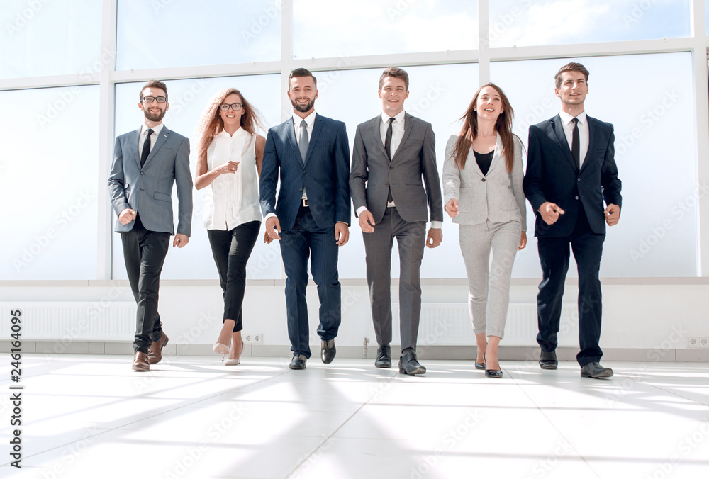successful business walking in the office lobby successful business walking in the office lobby