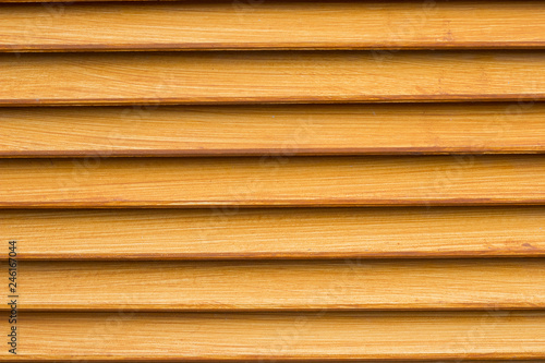 Light orange wall of the house lined with wooden. orange paint for design  texture pattern  nature pattern  wood orange.