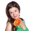 Portrait of a beautiful young woman with gerbera flower