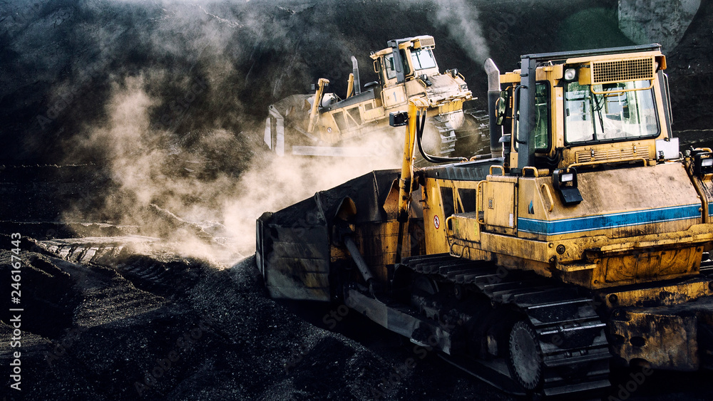 Excavators are working, coal mining, dirty job